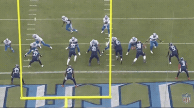 Football Game In Front Of Titans Logo GIF
