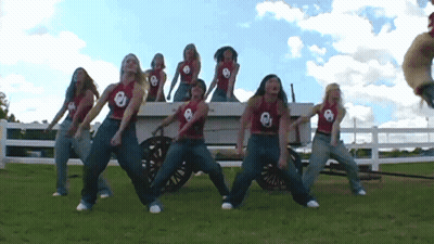 Football Game In Front Of Wendy's Sign GIF
