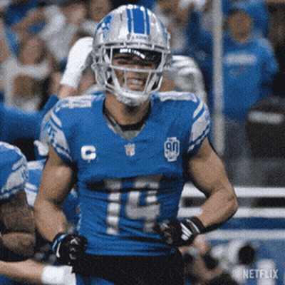 Football Game In Front Of Xfinity Sign GIF