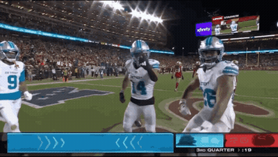 Football Game In Front Of Xfinity Sign GIF