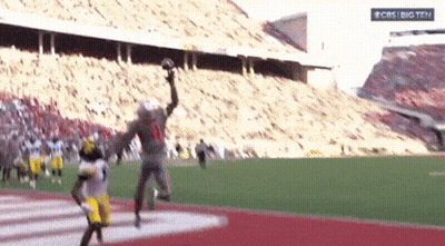 Football Game In Stadium With CBS Big Ten Sign GIF