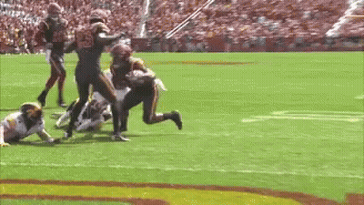 Football Game On Field With Stadium GIF