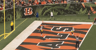 Football Game With Large B On Wall GIF