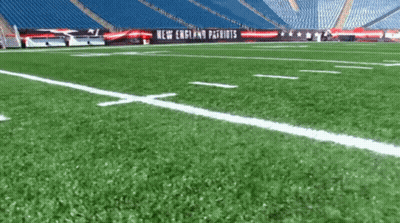 Football On Field With Patriots Banner GIF