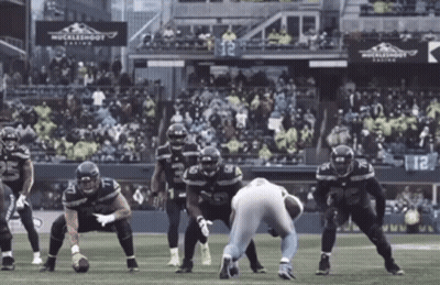 Football Player 54 Tackled GIF