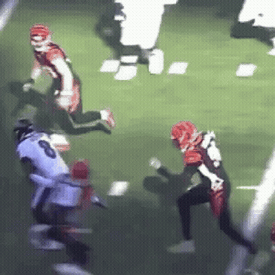 Football Player Being Tackled GIF