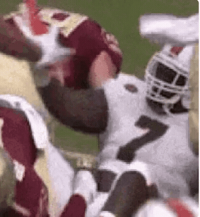 Football Player Being Tackled GIF