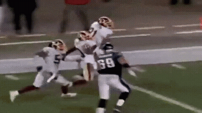 Football Player Being Tackled GIF
