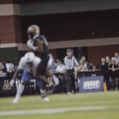 Football Player Being Tackled With BBC Sign GIF