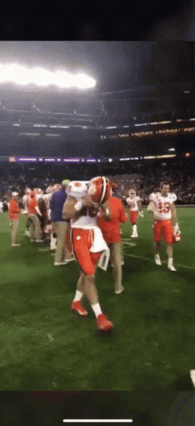 Football Player Carrying Football On Shoulders GIF