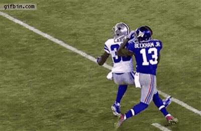 Football Player Catching Ball Blocked GIF