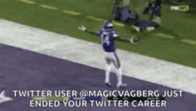 Football Player Celebrating Touchdown With Arms Outstretched GIF