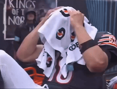 Football Player Covering Face With Towel Number 9
