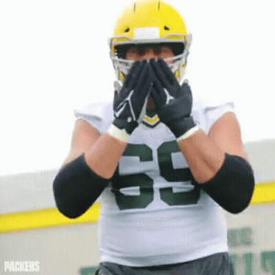 Football Player Covering Mouth GIF