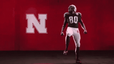 Football Player Dancing In Red Background With Letter N GIF