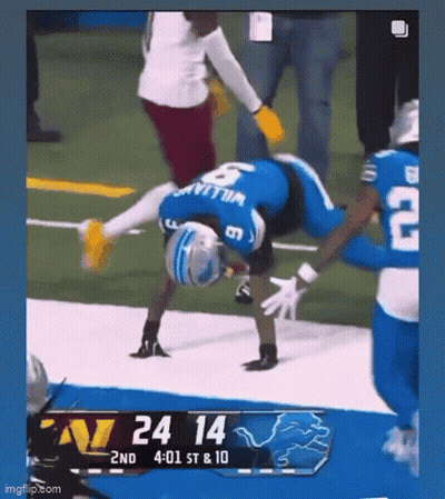 Football Player Doing Handstand On Field GIF