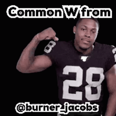 Football Player Flexing In Black And White Jersey GIF