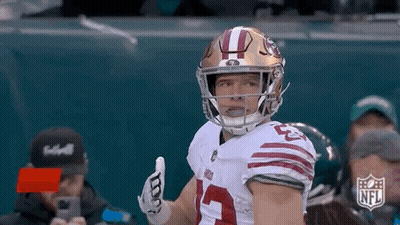 Football Player Giving Thumbs Up In Helmet And Gloves GIF