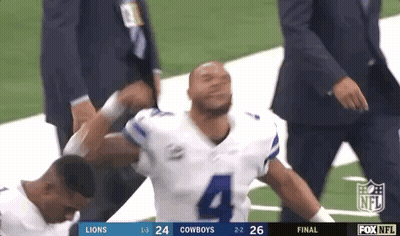 Football Player Helped Off Field By Coach GIF