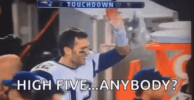 Football Player Holding Football High Fiving Crowd GIF