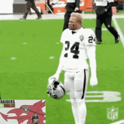 Football Player Holding Helmet And Ball GIF