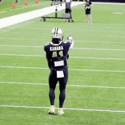Football Player Holding Helmet GIF