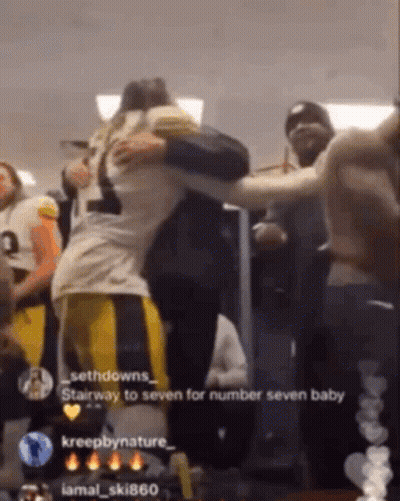 Football Player Hugging Another Player Saying Stairway To Seven GIF