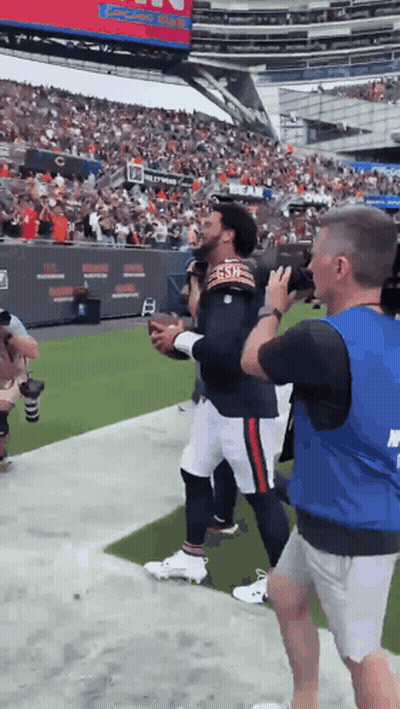 Football Player In Bears Jersey Escorted By Security Guard GIF