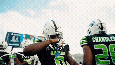 Football Player In Black And Green Uniform Number 28 GIF