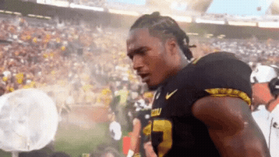 Football Player In Black And Yellow Jersey Number 23 GIF