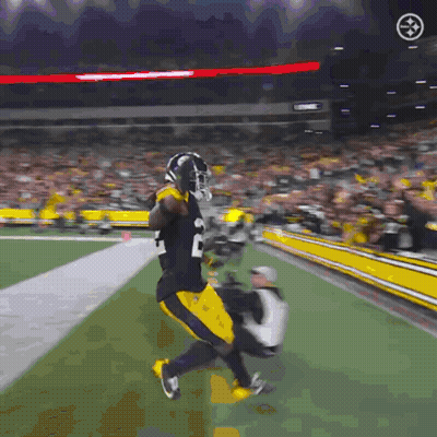 Football Player In Black And Yellow Uniform Number 20 GIF