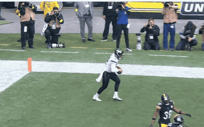Football Player In Black Uniform Number 33 GIF