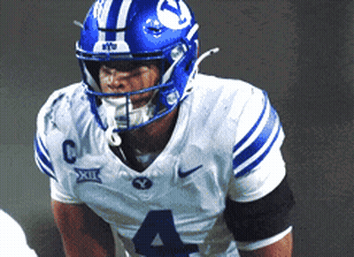 Football Player In Blue Helmet And Number 4 Jersey GIF