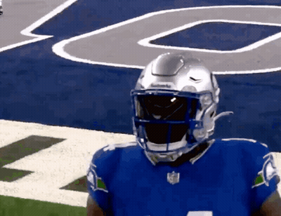 Football Player In Blue Jersey And Silver Helmet GIF