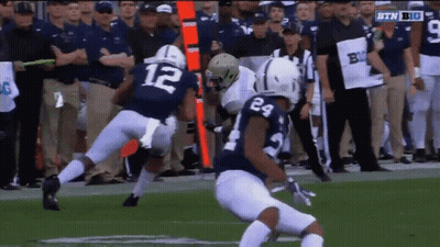 Football Player In Blue Jersey Number 12 GIF