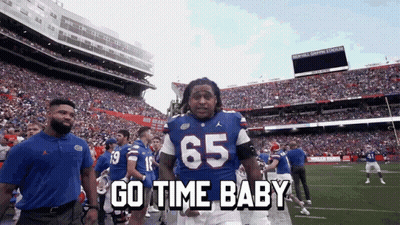 Football Player In Blue Jersey Number 65 GIF