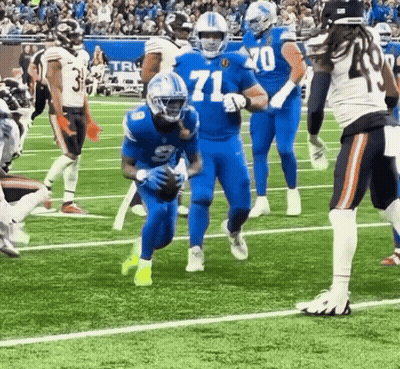 Football Player In Blue Jersey Number 71 GIF