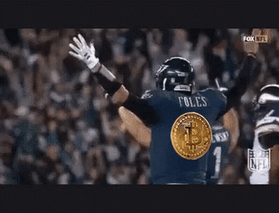 Football Player in Blue Jersey With Bitcoin