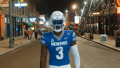 Football Player in Blue Memphis Jersey Number 3