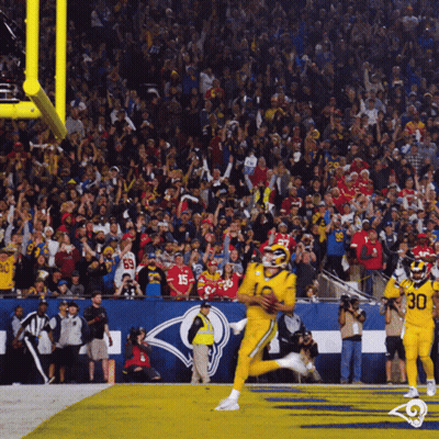 Football Player In Blue Uniform Running With Ball GIF
