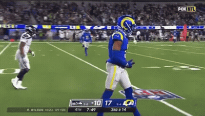 Football Player In Blue Uniform Walking On Field GIF