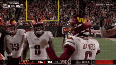 Football Player In Daniels Jersey Talking To Another GIF