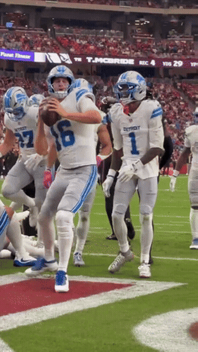 Football Player In Detroit Jersey Throws Ball GIF