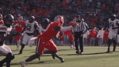 Football Player In Front Of Crowd With Goal Post GIF