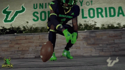 Football Player In Front Of University Of Florida Sign GIF