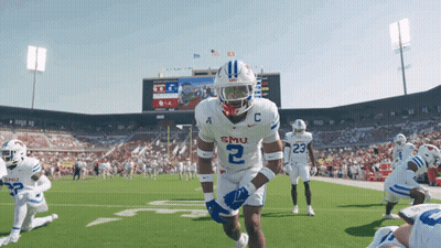 Football Player In Front Of Wing Stop Scoreboard GIF