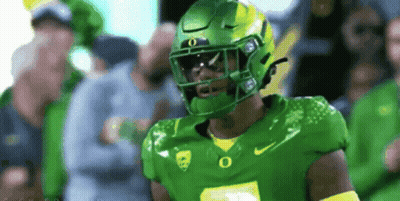 Football Player In Green Helmet With Yellow O GIF