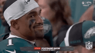Football Player In Green Jersey And Headband Smiling GIF