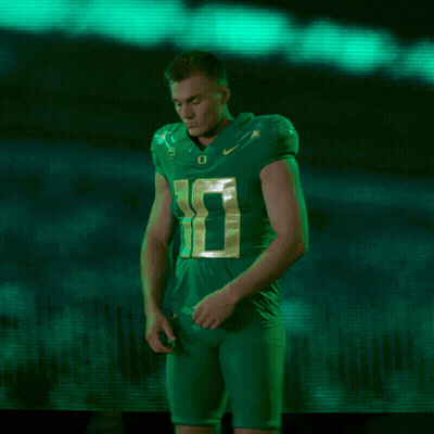 Football Player In Green Jersey Number 10 Arms Crossed GIF