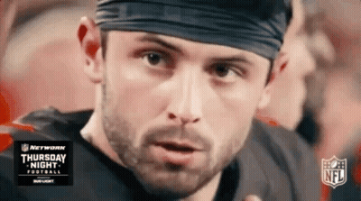 Football Player In Headband Looking At Camera GIF
